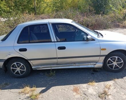 Серый Ниссан Санни, объемом двигателя 1.4 л и пробегом 280 тыс. км за 1800 $, фото 5 на Automoto.ua