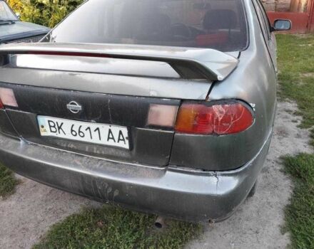 Серый Ниссан Санни, объемом двигателя 1.6 л и пробегом 999 тыс. км за 600 $, фото 1 на Automoto.ua