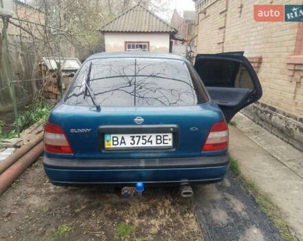Синий Ниссан Санни, объемом двигателя 1.39 л и пробегом 325 тыс. км за 1350 $, фото 1 на Automoto.ua