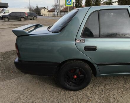 Зелений Ніссан Санні, об'ємом двигуна 1.4 л та пробігом 444 тис. км за 1649 $, фото 3 на Automoto.ua