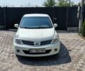 Белый Ниссан Тиида, объемом двигателя 1.5 л и пробегом 159 тыс. км за 8199 $, фото 2 на Automoto.ua
