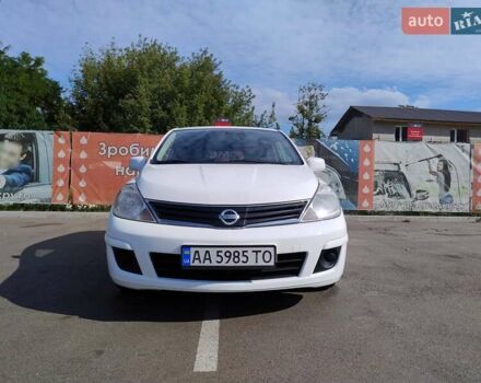 Белый Ниссан Тиида, объемом двигателя 1.6 л и пробегом 155 тыс. км за 7200 $, фото 1 на Automoto.ua