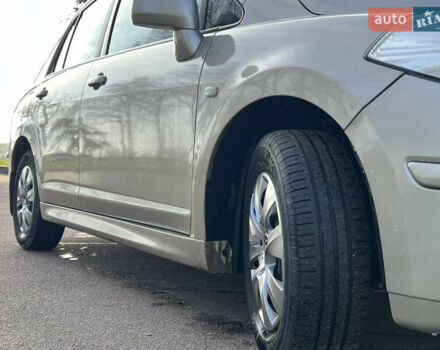 Бежевий Ніссан Тііда, об'ємом двигуна 1.6 л та пробігом 165 тис. км за 6600 $, фото 11 на Automoto.ua