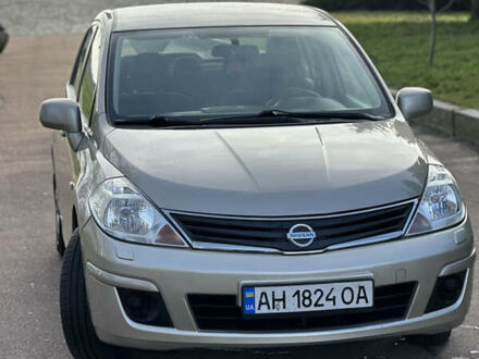 Бежевый Ниссан Тиида, объемом двигателя 1.6 л и пробегом 165 тыс. км за 6600 $, фото 1 на Automoto.ua