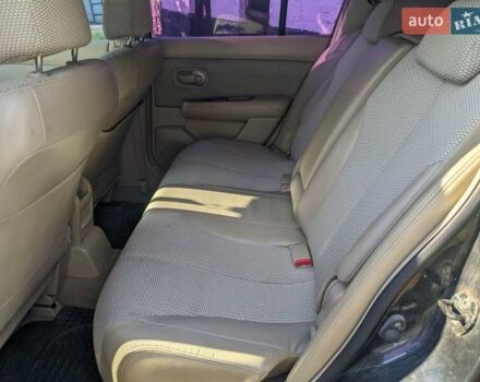 Черный Ниссан Тиида, объемом двигателя 1.6 л и пробегом 209 тыс. км за 4400 $, фото 1 на Automoto.ua