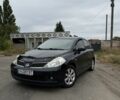 Черный Ниссан Тиида, объемом двигателя 1.6 л и пробегом 270 тыс. км за 5700 $, фото 1 на Automoto.ua