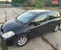 Черный Ниссан Тиида, объемом двигателя 1.6 л и пробегом 196 тыс. км за 6400 $, фото 1 на Automoto.ua
