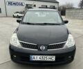 Черный Ниссан Тиида, объемом двигателя 1.6 л и пробегом 188 тыс. км за 5800 $, фото 1 на Automoto.ua