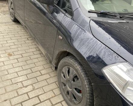 Черный Ниссан Тиида, объемом двигателя 1.6 л и пробегом 200 тыс. км за 4500 $, фото 1 на Automoto.ua