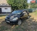 Черный Ниссан Тиида, объемом двигателя 1.6 л и пробегом 209 тыс. км за 4300 $, фото 1 на Automoto.ua