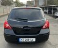 Черный Ниссан Тиида, объемом двигателя 1.8 л и пробегом 226 тыс. км за 4200 $, фото 1 на Automoto.ua