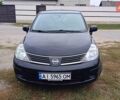 Черный Ниссан Тиида, объемом двигателя 1.6 л и пробегом 330 тыс. км за 4900 $, фото 1 на Automoto.ua