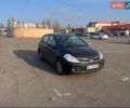 Черный Ниссан Тиида, объемом двигателя 1.6 л и пробегом 194 тыс. км за 5200 $, фото 1 на Automoto.ua
