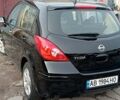 Черный Ниссан Тиида, объемом двигателя 1.6 л и пробегом 300 тыс. км за 4550 $, фото 3 на Automoto.ua