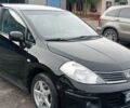 Черный Ниссан Тиида, объемом двигателя 1.6 л и пробегом 300 тыс. км за 4550 $, фото 1 на Automoto.ua