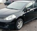 Черный Ниссан Тиида, объемом двигателя 1.6 л и пробегом 300 тыс. км за 4550 $, фото 1 на Automoto.ua