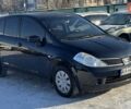 Черный Ниссан Тиида, объемом двигателя 1.6 л и пробегом 200 тыс. км за 5799 $, фото 1 на Automoto.ua