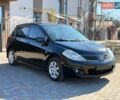 Черный Ниссан Тиида, объемом двигателя 1.6 л и пробегом 167 тыс. км за 7000 $, фото 1 на Automoto.ua