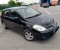 Черный Ниссан Тиида, объемом двигателя 1.6 л и пробегом 215 тыс. км за 5500 $, фото 1 на Automoto.ua