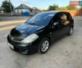 Черный Ниссан Тиида, объемом двигателя 1.6 л и пробегом 208 тыс. км за 5800 $, фото 1 на Automoto.ua
