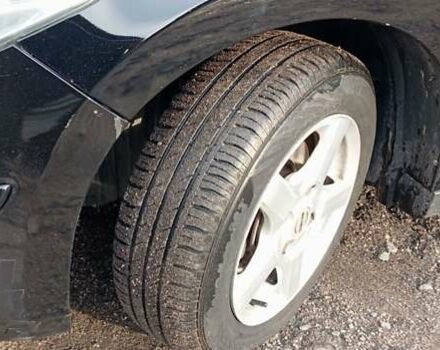 Черный Ниссан Тиида, объемом двигателя 1.6 л и пробегом 300 тыс. км за 4550 $, фото 11 на Automoto.ua