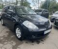 Черный Ниссан Тиида, объемом двигателя 1.6 л и пробегом 230 тыс. км за 5850 $, фото 1 на Automoto.ua