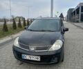 Черный Ниссан Тиида, объемом двигателя 1.6 л и пробегом 220 тыс. км за 5300 $, фото 1 на Automoto.ua