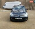 Черный Ниссан Тиида, объемом двигателя 1.6 л и пробегом 185 тыс. км за 6200 $, фото 1 на Automoto.ua