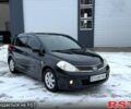 Черный Ниссан Тиида, объемом двигателя 1.8 л и пробегом 200 тыс. км за 4650 $, фото 1 на Automoto.ua