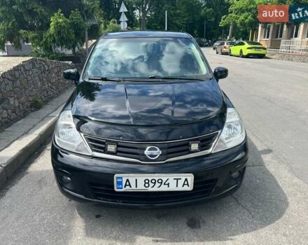 Черный Ниссан Тиида, объемом двигателя 1.6 л и пробегом 237 тыс. км за 6199 $, фото 2 на Automoto.ua