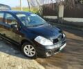 Черный Ниссан Тиида, объемом двигателя 1.6 л и пробегом 170 тыс. км за 2750 $, фото 1 на Automoto.ua