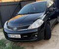 Черный Ниссан Тиида, объемом двигателя 1.6 л и пробегом 215 тыс. км за 9000 $, фото 1 на Automoto.ua