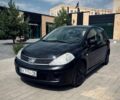 Черный Ниссан Тиида, объемом двигателя 1.6 л и пробегом 301 тыс. км за 5750 $, фото 1 на Automoto.ua