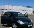 Черный Ниссан Тиида, объемом двигателя 1.5 л и пробегом 100 тыс. км за 8000 $, фото 1 на Automoto.ua