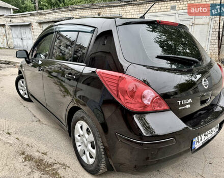 Черный Ниссан Тиида, объемом двигателя 1.6 л и пробегом 95 тыс. км за 10200 $, фото 2 на Automoto.ua