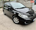 Черный Ниссан Тиида, объемом двигателя 1.6 л и пробегом 95 тыс. км за 10200 $, фото 1 на Automoto.ua