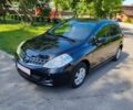 Черный Ниссан Тиида, объемом двигателя 1.5 л и пробегом 84 тыс. км за 8900 $, фото 1 на Automoto.ua
