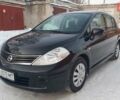 Черный Ниссан Тиида, объемом двигателя 1.6 л и пробегом 153 тыс. км за 7950 $, фото 1 на Automoto.ua