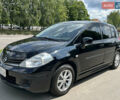 Черный Ниссан Тиида, объемом двигателя 1.6 л и пробегом 188 тыс. км за 6500 $, фото 1 на Automoto.ua