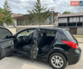 Черный Ниссан Тиида, объемом двигателя 1.6 л и пробегом 190 тыс. км за 7500 $, фото 1 на Automoto.ua