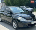 Черный Ниссан Тиида, объемом двигателя 1.6 л и пробегом 188 тыс. км за 6500 $, фото 2 на Automoto.ua