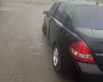 Черный Ниссан Тиида, объемом двигателя 1.6 л и пробегом 150 тыс. км за 5600 $, фото 2 на Automoto.ua