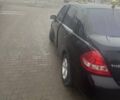 Черный Ниссан Тиида, объемом двигателя 1.6 л и пробегом 150 тыс. км за 5600 $, фото 2 на Automoto.ua