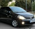 Черный Ниссан Тиида, объемом двигателя 1.6 л и пробегом 156 тыс. км за 6499 $, фото 1 на Automoto.ua