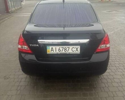 Черный Ниссан Тиида, объемом двигателя 1.6 л и пробегом 150 тыс. км за 5600 $, фото 1 на Automoto.ua
