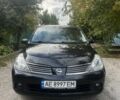Черный Ниссан Тиида, объемом двигателя 1.6 л и пробегом 304 тыс. км за 4700 $, фото 1 на Automoto.ua