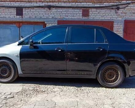 Черный Ниссан Тиида, объемом двигателя 1.6 л и пробегом 210 тыс. км за 3900 $, фото 1 на Automoto.ua