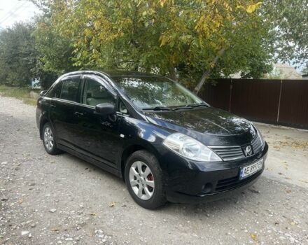 Черный Ниссан Тиида, объемом двигателя 1.6 л и пробегом 304 тыс. км за 4700 $, фото 1 на Automoto.ua