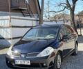 Черный Ниссан Тиида, объемом двигателя 1.6 л и пробегом 180 тыс. км за 5250 $, фото 1 на Automoto.ua