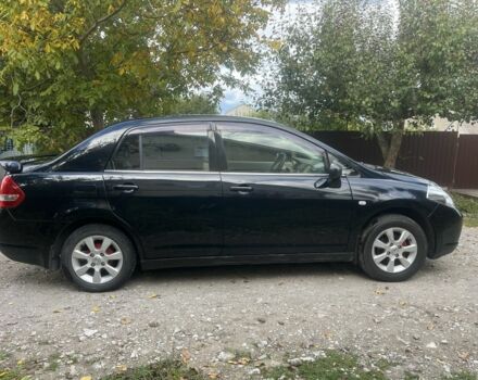 Черный Ниссан Тиида, объемом двигателя 1.6 л и пробегом 304 тыс. км за 4700 $, фото 2 на Automoto.ua